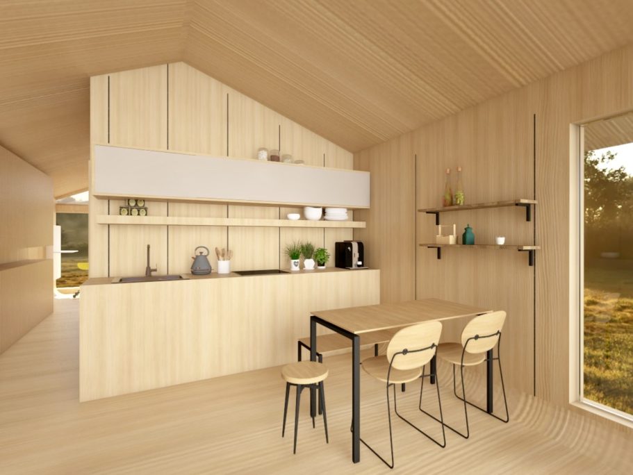 Rustikales, helles Holzinterieur mit Küchenecke und einem Tisch mit Stühlen.